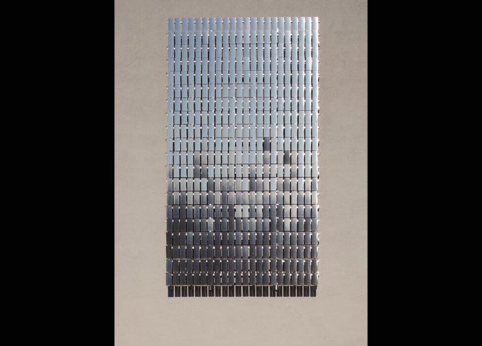 rectangular art work made up of smaller rectangular reflective shapes